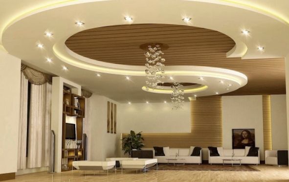 Спиральное расположение центрального элемента потолочной конструкции из гипсокартона уравновешивает высокие потолки. 